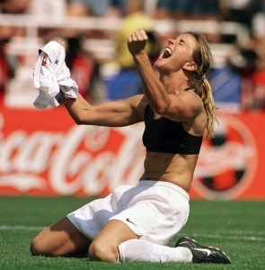 Brandi Chastain taking her shirt off triumphantly after winning the World Cup