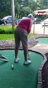 Ginny playing mini golf July 11