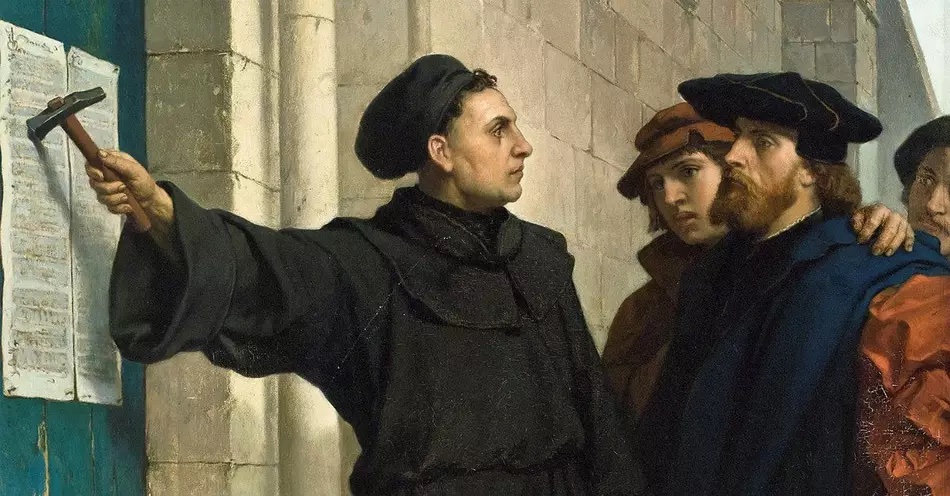 Painting of Martin Luther nailing his 95 theses to the door of the cathedral was others look on